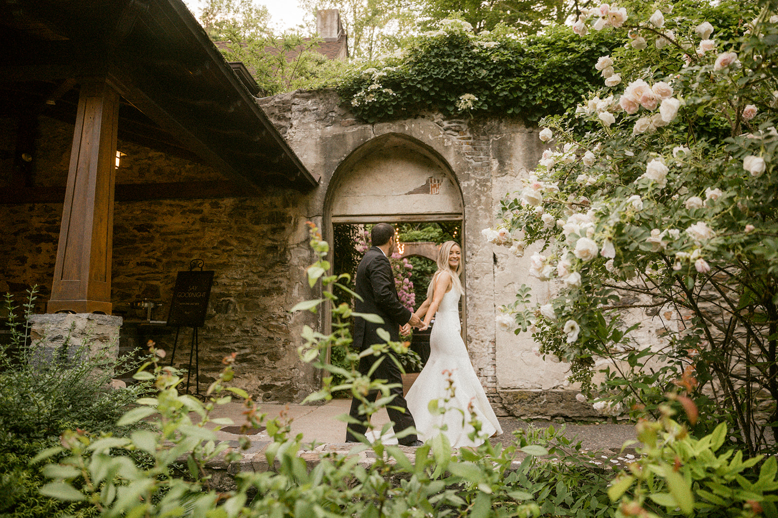 the old mill wedding philadelphia couples portrait arch ivy wall