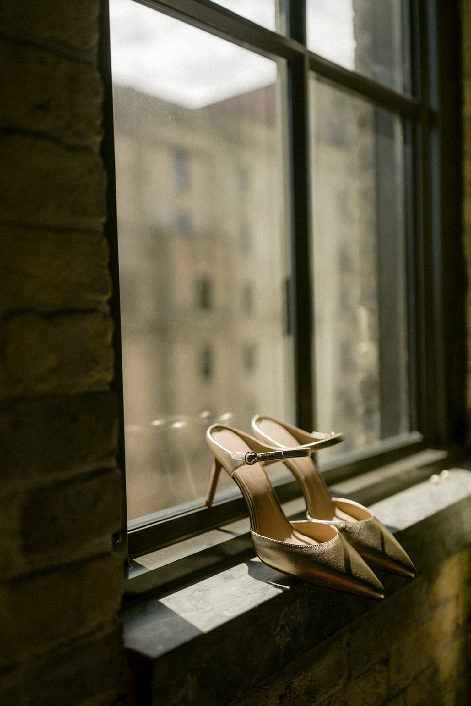 gold pointed shoes bride in window Pabst Best Place Brewery Wedding