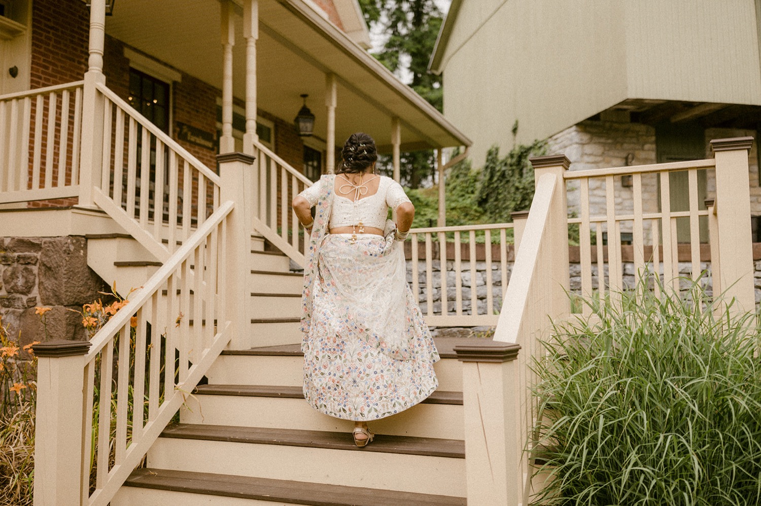 bride walking up stairs steps Historic Acres of Hershey Wedding