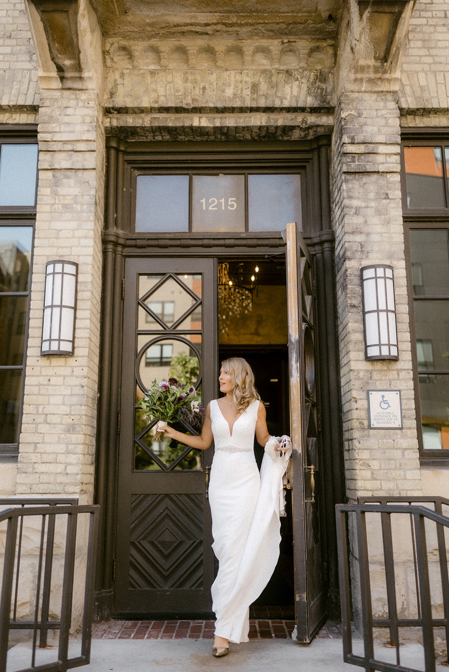 bride holding bouquet ornate door Pabst Best Place Brewery Wedding