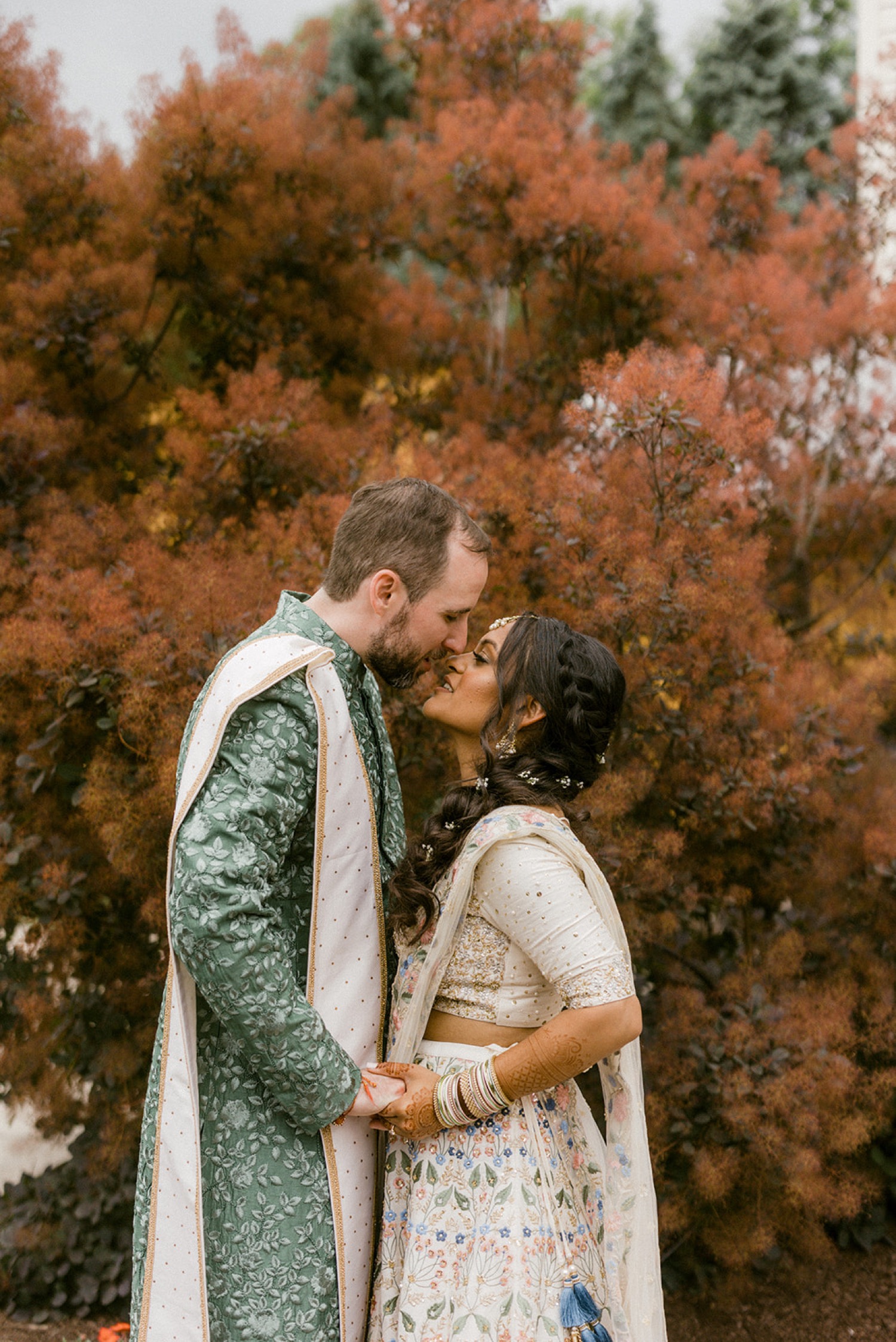couple kissing red tree Historic Acres of Hershey Wedding