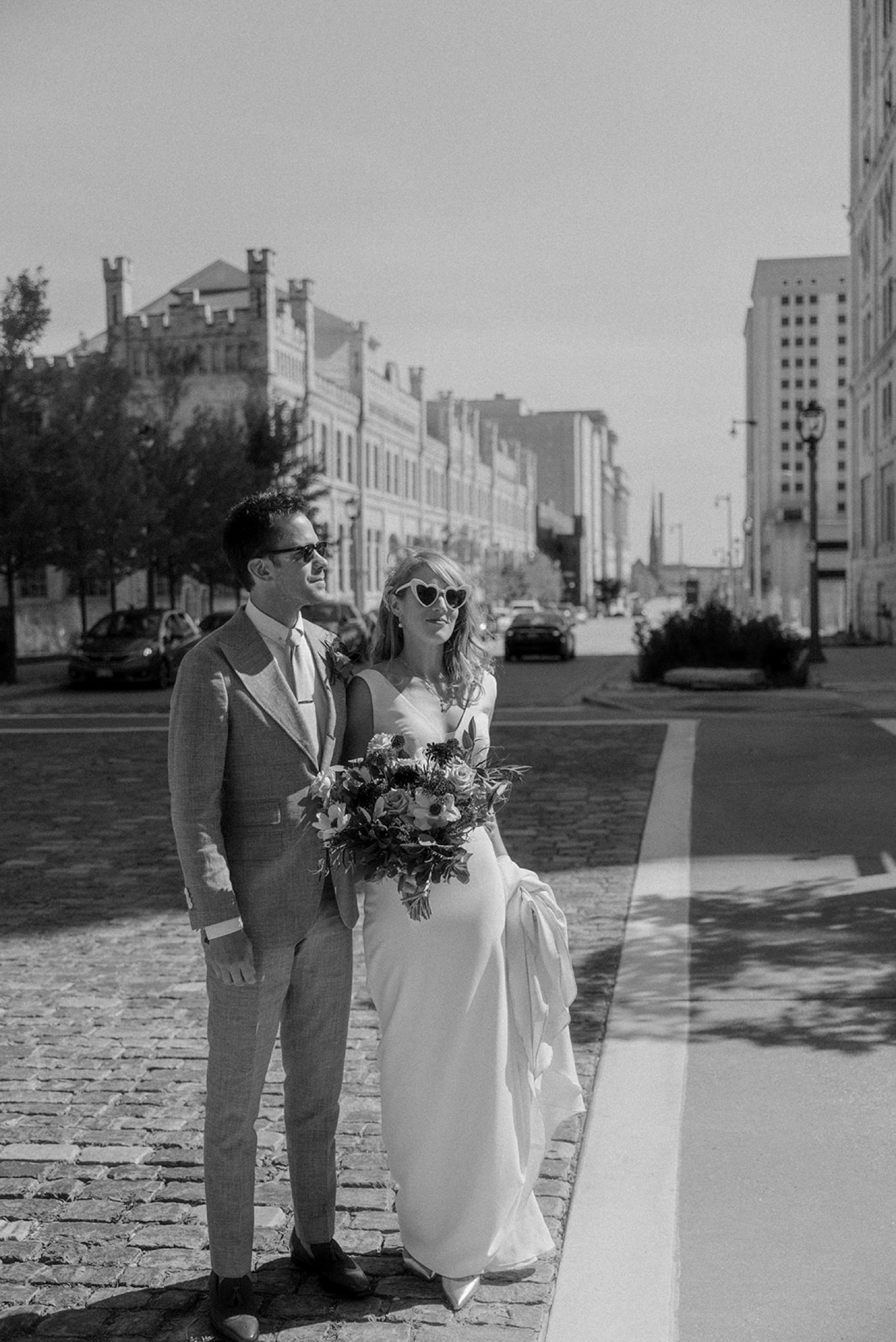 bride wearing heart sunglasses wedding portrait downtown Milwaukee