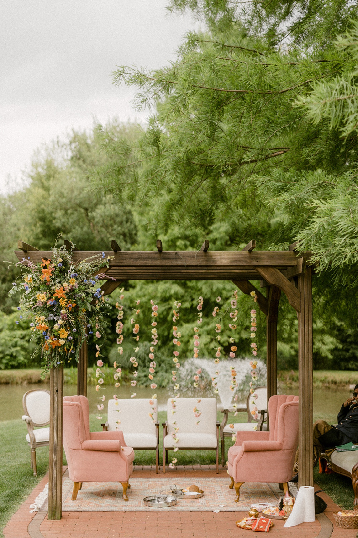 pink chairs hanging flower curtain Historic Acres of Hershey Wedding
