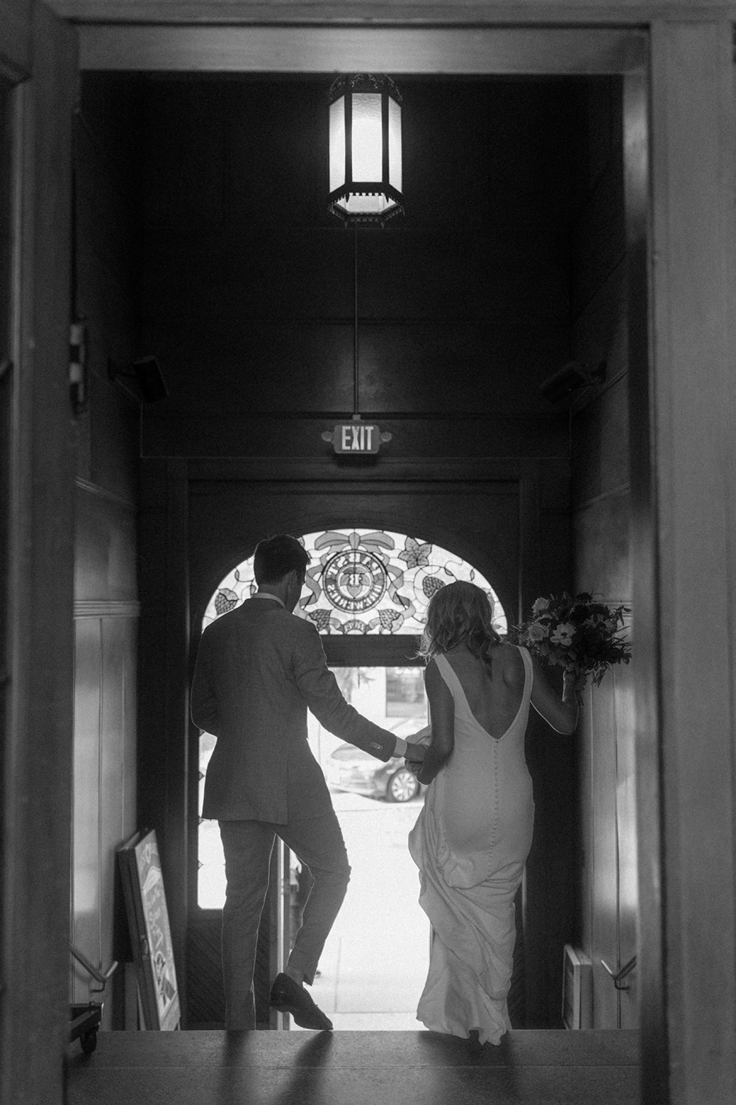 bride and groom leaving wedding ceremony Pabst Best Place Brewery Wedding