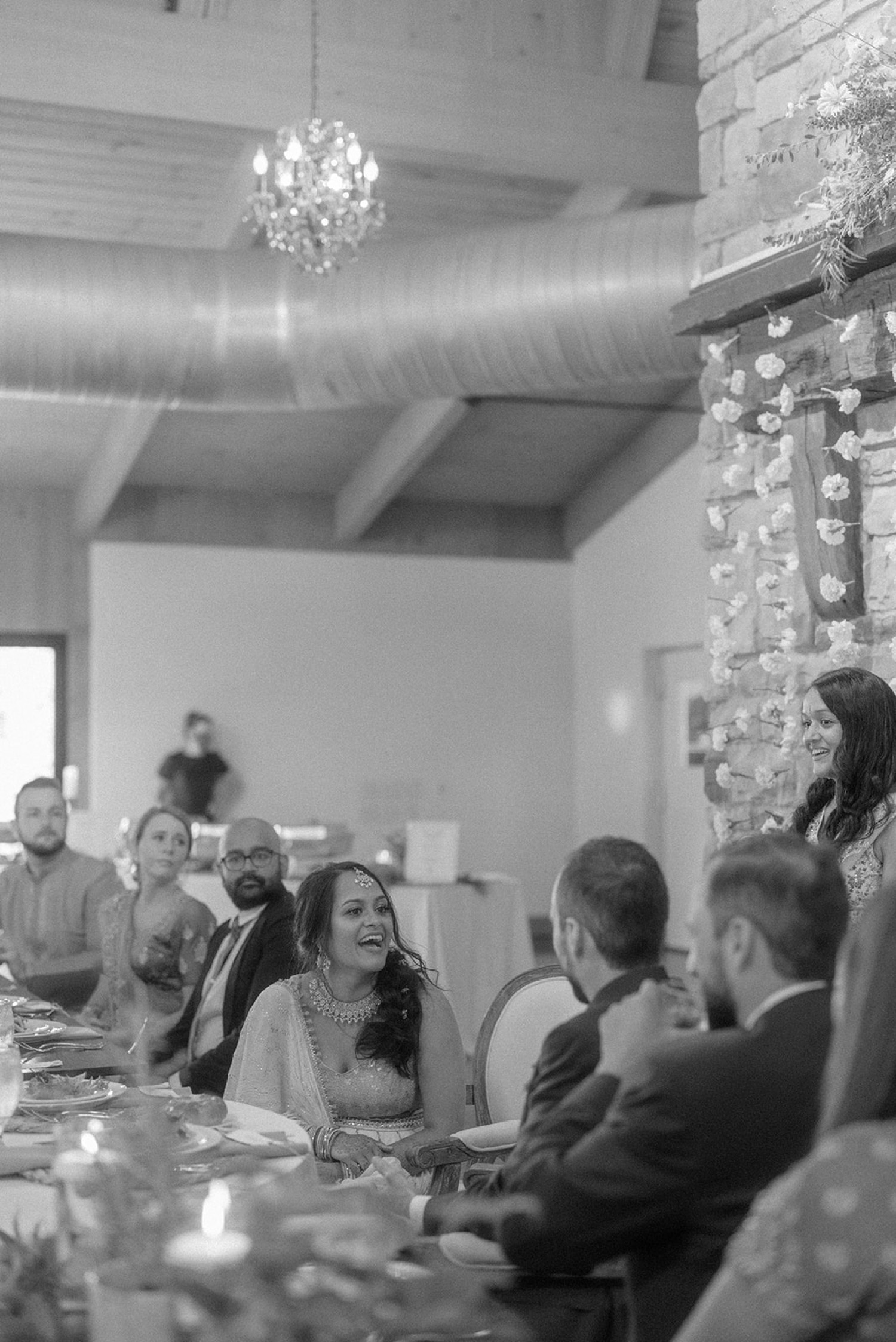 bride and groom laughing at wedding toasts