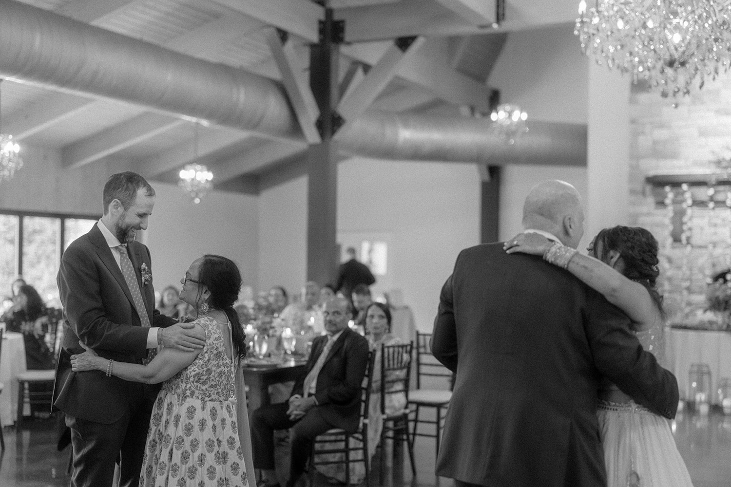 bride and groom dancing with parents wedding reception