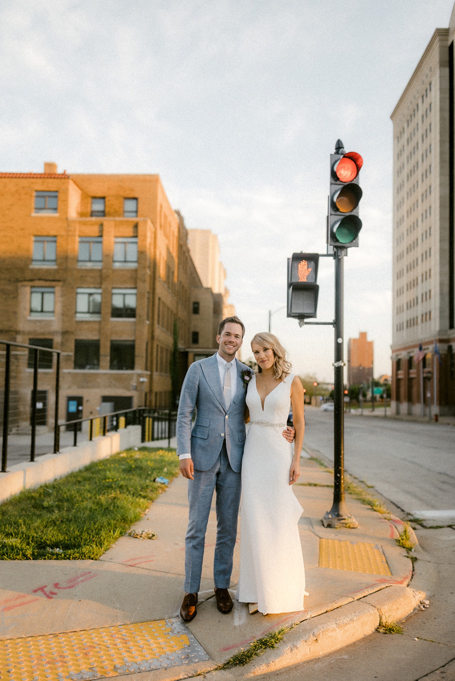 bride and groom at traffic light downtown Milwaukee wedding