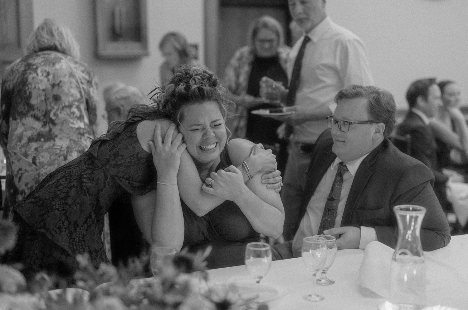 bridesmaids hugging crying wedding