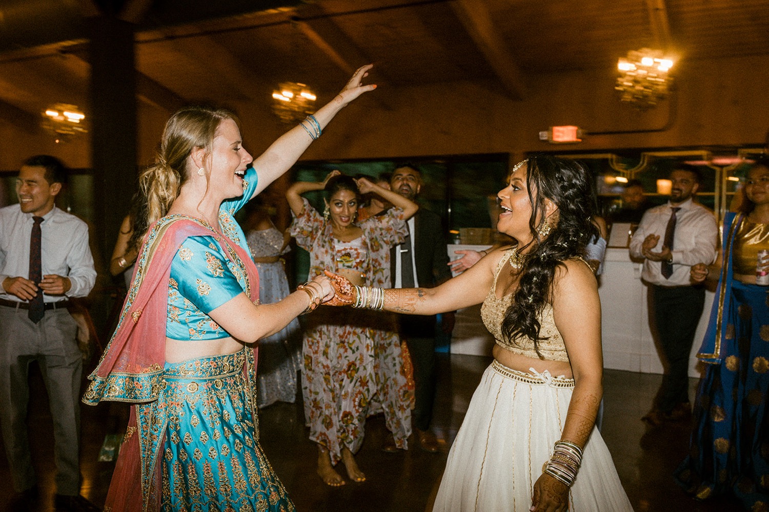 bride and sister in law dancing wedding reception