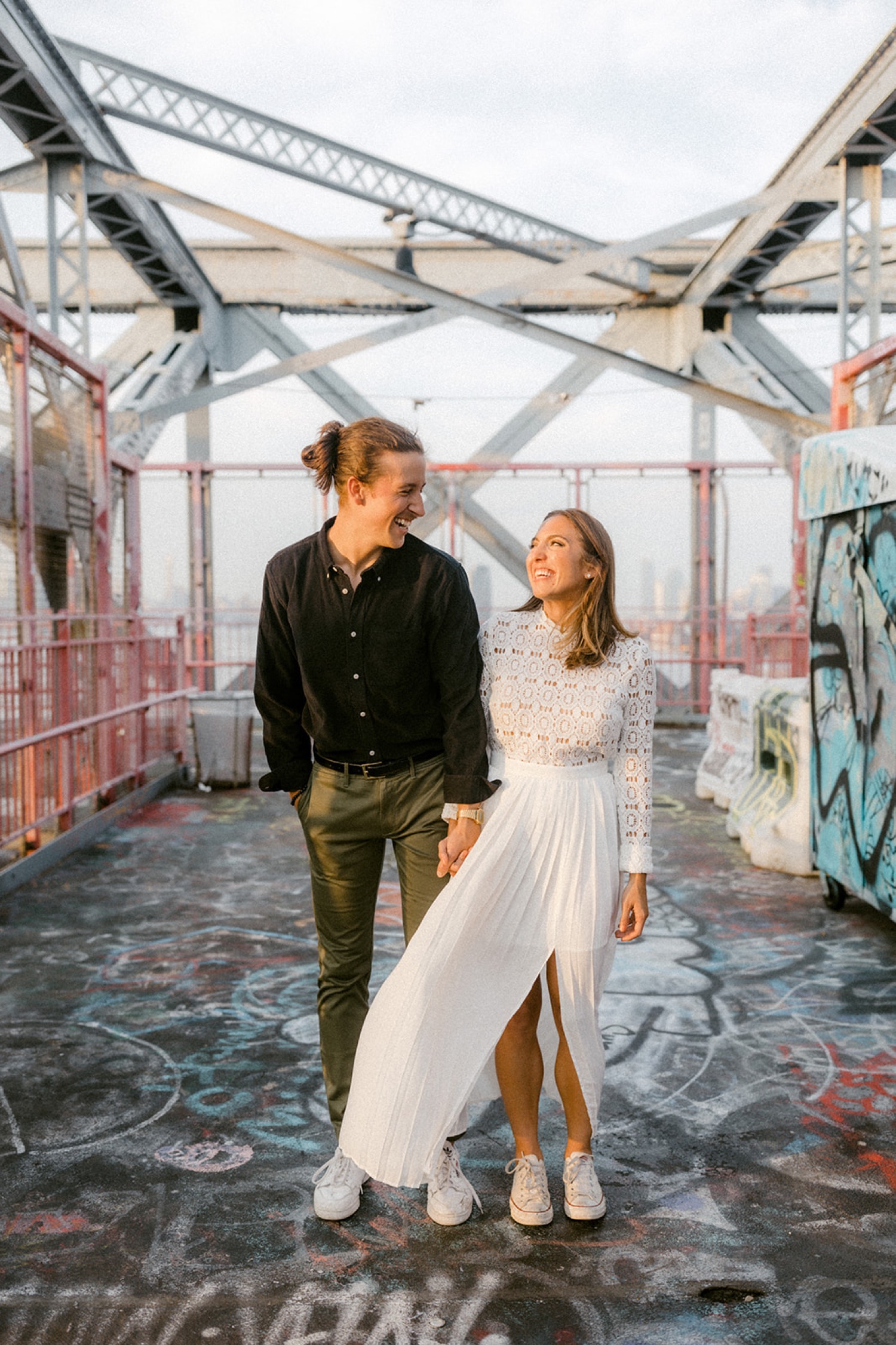 couple holding hands graffiti brooklyn engagement session