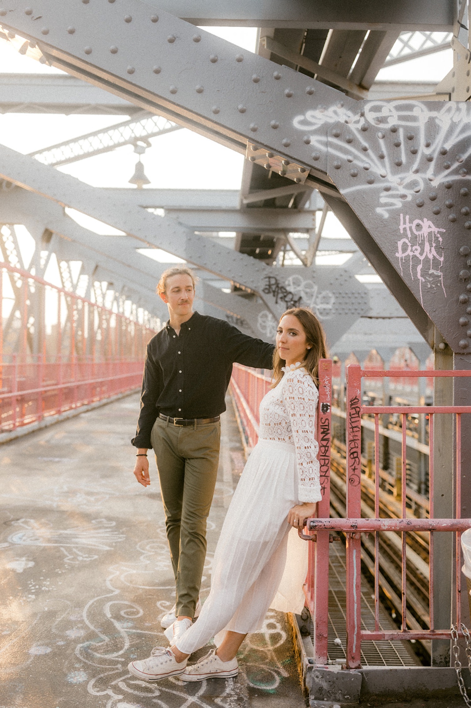 couple on iron bridge brooklyn engagement session