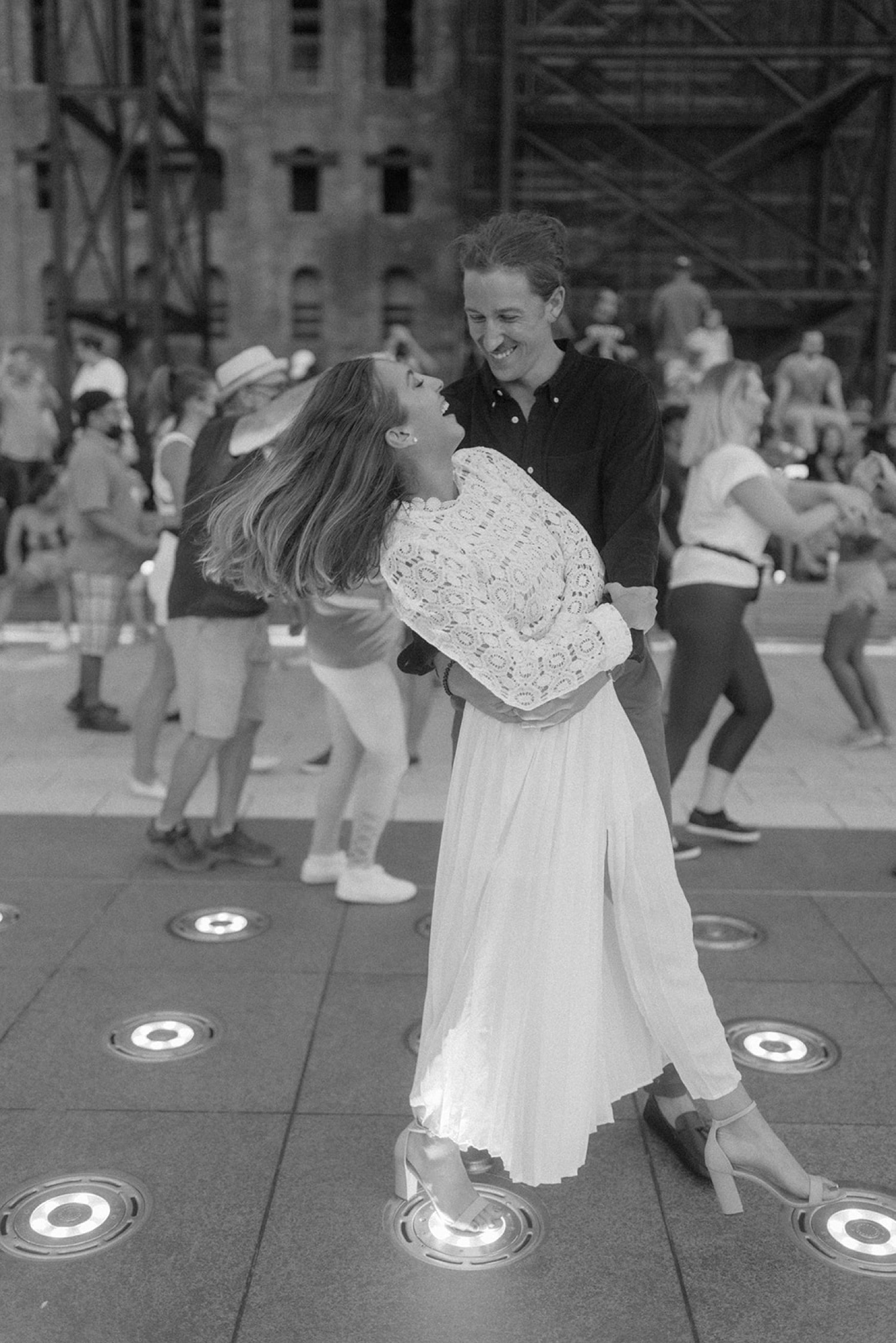 couple dancing in city