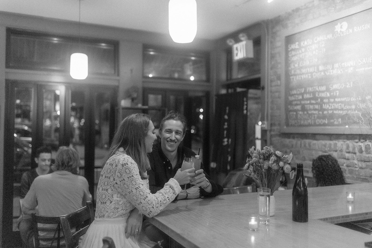 couple laughing at cocktail bar